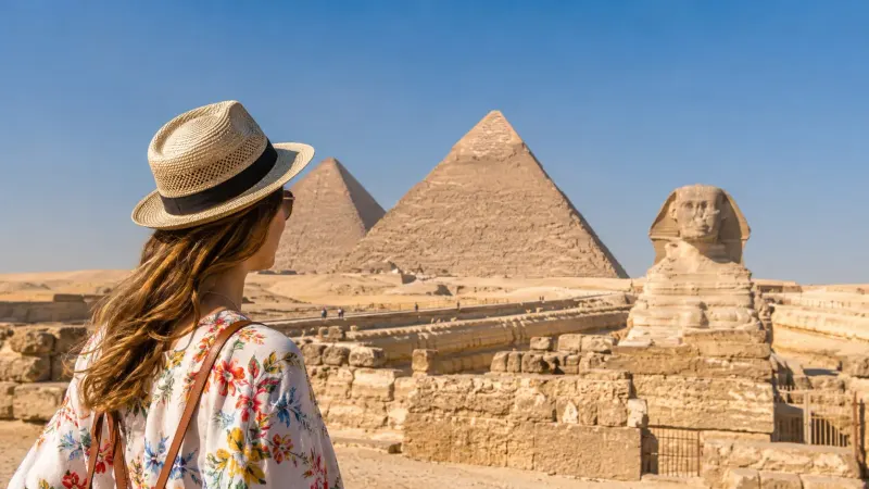 The Great Pyramids of Giza and the Sphinx under a clear sky in Egypt in a tour organized by Piccola Travel, a Miami, Florida travel agency.