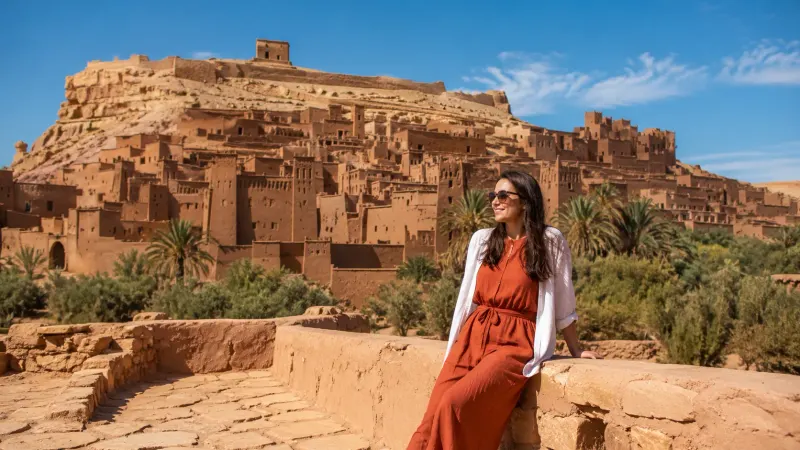 Traditional clay-built Ait Benhaddou kasbah city at the edge of the Sahara desert along a Morocco cultural tours itinerary organized by Piccola Travel, a Miami travel agency.
