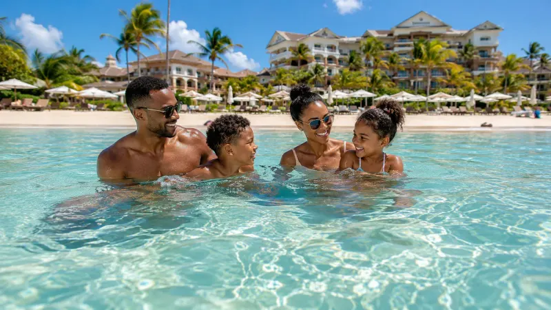 Family on the beach at a Jamaica all-inclusive resort