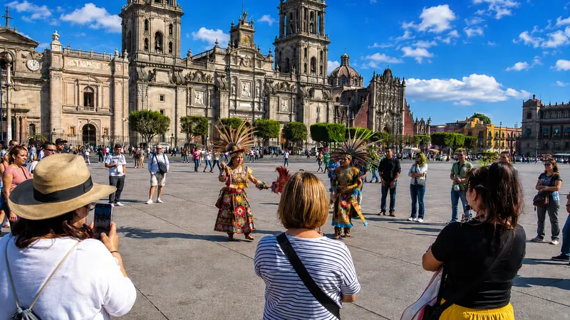 Folk dancers performing by the Metropolitan Cathedral in Mexico City's Zócalo