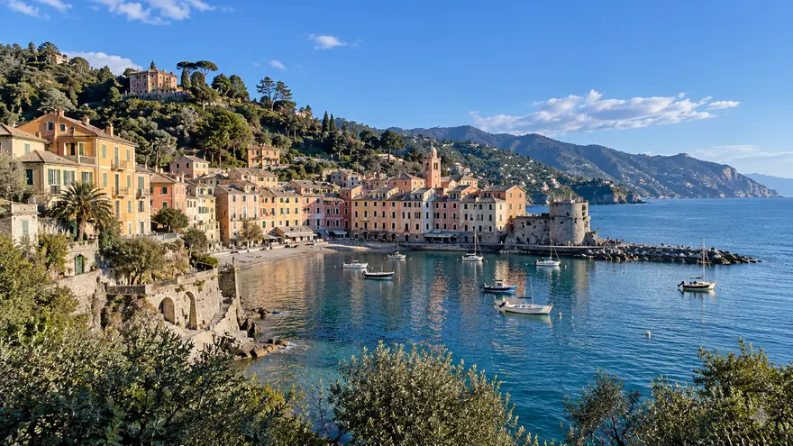 Pastel houses and fishing boats around a bay on the Italian Riviera near Sestri Levante
