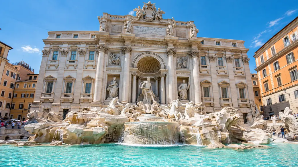 The Trevi Fountain in Rome with turquoise water and white marble sculptures