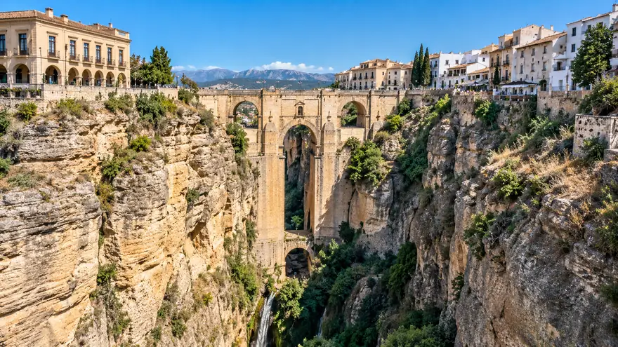 The Puente Nuevo spanning the deep gorge of Ronda under a blue sky