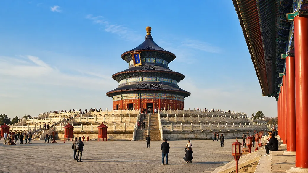 The circular Hall of Prayer of the Temple of Heaven rising over marble terraces in Beijing on a guided China tour