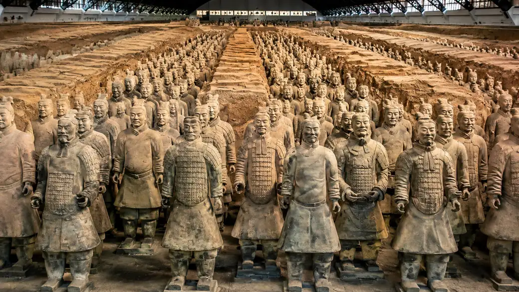 Rows of Terracotta Army warriors standing in the excavation pit at Xi'an, a highlight of this China itinerary